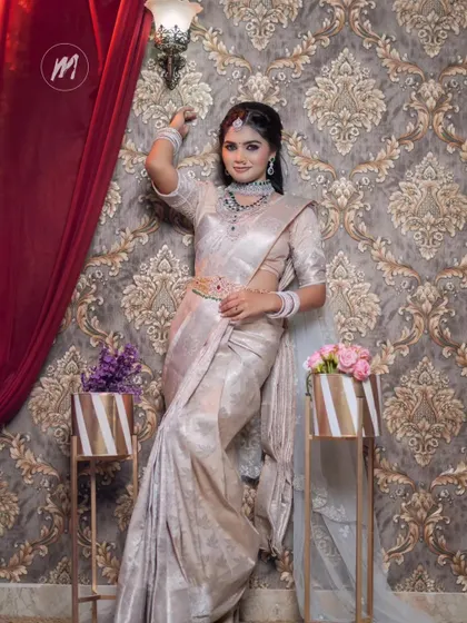 A stylish pose against a damask wallpaper, this shot highlights the modern yet traditional feel of the ensemble.