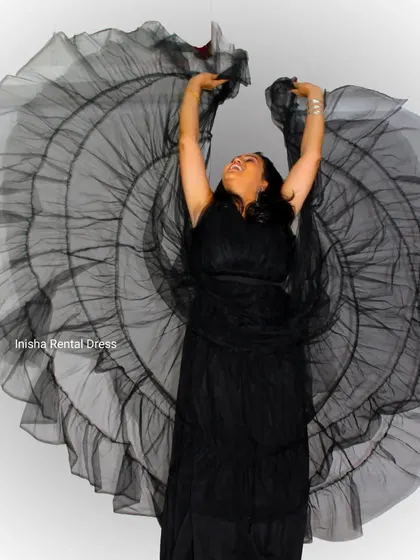 This black net gown comes with a large, fan-like fabric piece that can be used to create dramatic, wing-like shapes for your photos.
