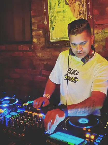 Playing a private gig at La Favela in Bali, a famous and eclectic nightclub. This shows my versatility in handling different types of venues and crowds.
