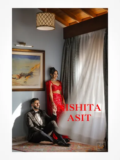 An artistic indoor portrait of the couple, using shadows and light to create a moody and romantic atmosphere.