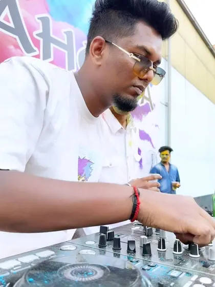 Adjusting the levels on my mixer during an outdoor day party. I can bring the party to any setting, day or night.