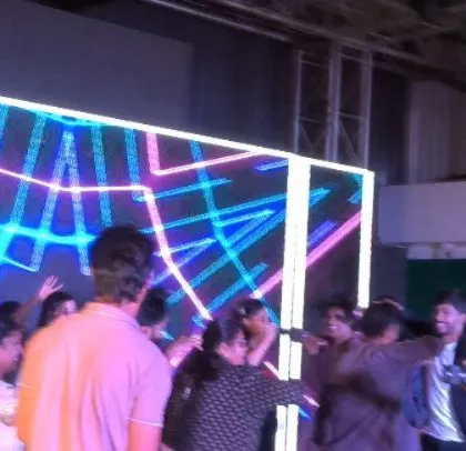 The LED screen displays vibrant, abstract patterns.