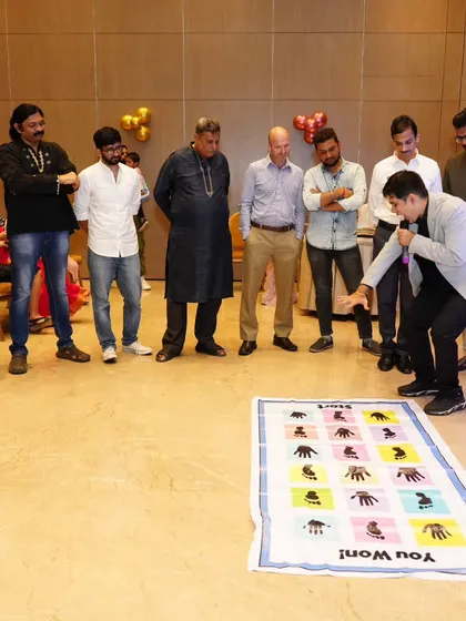Explaining the rules of the mat game to a group of enthusiastic participants.