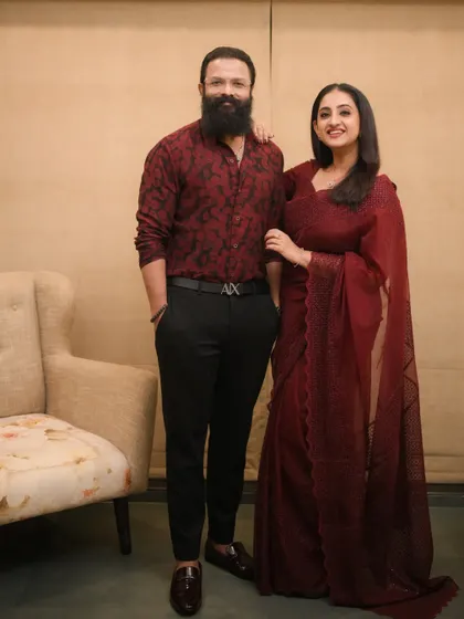 A beautiful portrait of actor Jayasurya and his wife Saritha. She looks stunning in the maroon saree I draped for her.