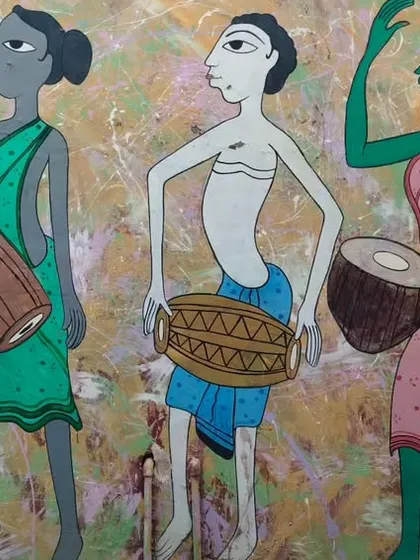 The completed wall mural, a vibrant depiction of tribal musicians and dancers. This artwork now brightens up the entire street.