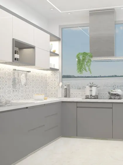 This kitchen design for a small flat features a beautiful patterned tile backsplash that adds personality. The two-tone grey and white cabinets keep the space feeling bright and open.