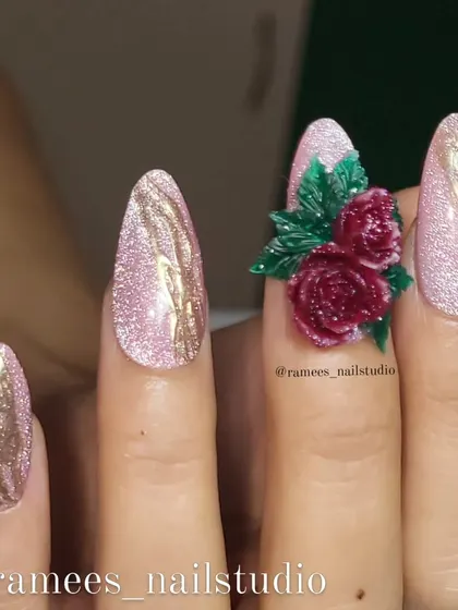 A luxurious press-on nail set. This design combines a sparkling pink cat-eye polish with a stunning, hand-sculpted 3D rose bouquet on the accent nail.