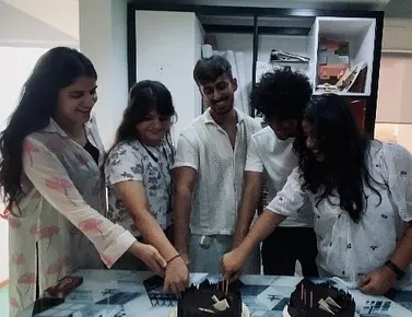 A close-up of the farewell cake cutting.