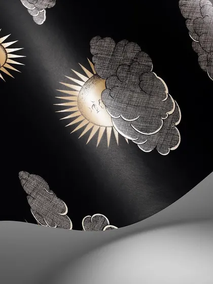 The dramatic black and white 'Soli e Nuvole' wallpaper. This high-contrast version emphasizes the graphic quality of Fornasetti's artwork, making a powerful and timeless design statement.