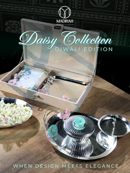 The Daisy Collection, created for Diwali, shows how I blend festive tradition with contemporary elegance. This bespoke hamper, featuring a silver-plated tray set and a personalized message, is designed to light up your corporate celebrations and add that special touch of 'mithaas'.