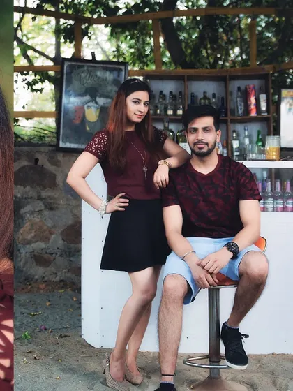 A cool and casual portrait from their pre-wedding shoot at an outdoor bar. This shows their modern, relaxed style as a couple.