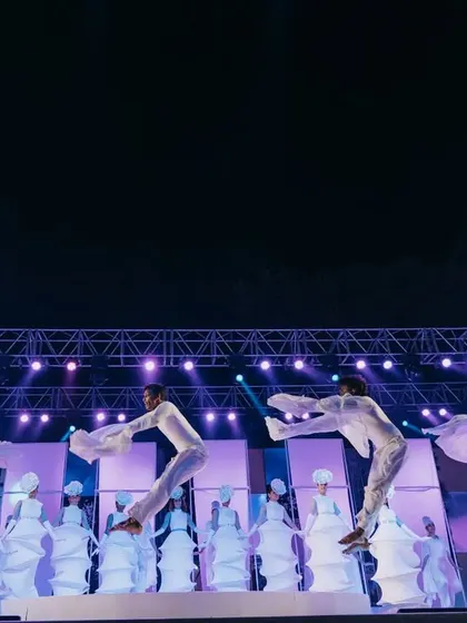 Another shot of the incredible dance performance, with the dancers in white creating beautiful shapes on stage.