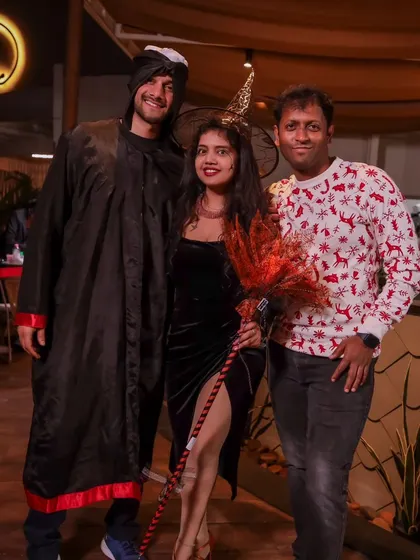 Friends and fun costumes at our Halloween social. It's a great chance for everyone to relax, dress up, and enjoy the party atmosphere.