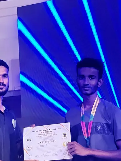 A proud moment for our fighter receiving his certificate at the WMC event.
