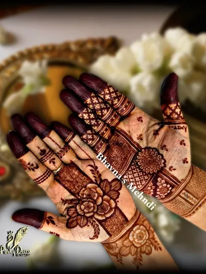 A beautiful example of a rose-themed design with filled fingertips. The contrast between the delicate floral work and the dark, solid tips creates a striking and elegant look.