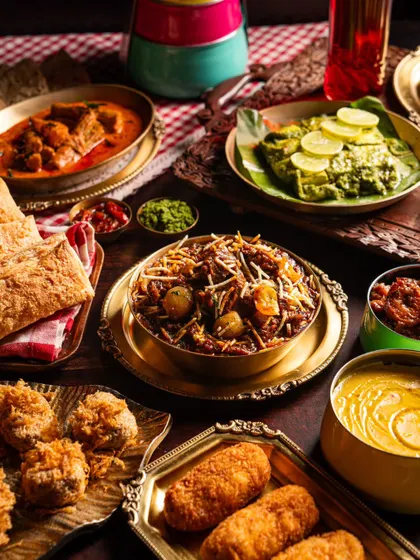 A grand feast of classic Indian dishes from Gallops. This bountiful spread, featuring everything from curries to biryani and kebabs, showcases the restaurant's expertise in traditional fine dining.