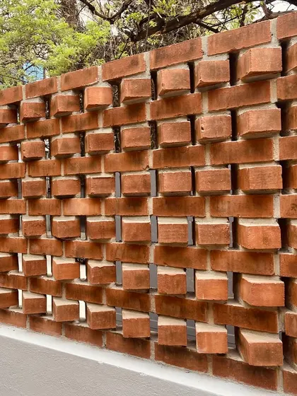 A close-up of our protruding brick wall. This technique, often called a dental bond, creates a dynamic, three-dimensional texture that changes dramatically with the light.