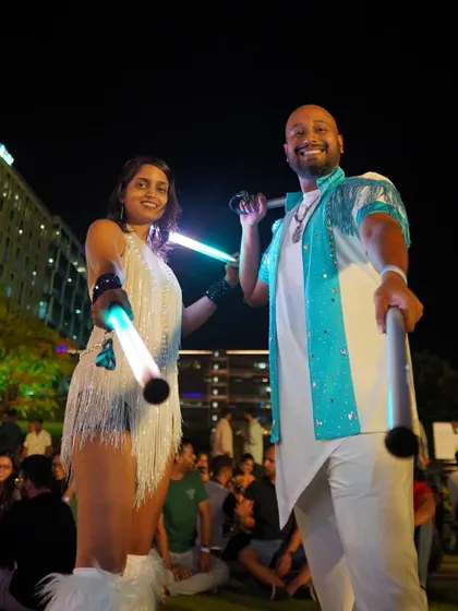 Post-show vibes with Yacobeh after a performance. We love coordinating our outfits, and this all-white look was perfect for the event.