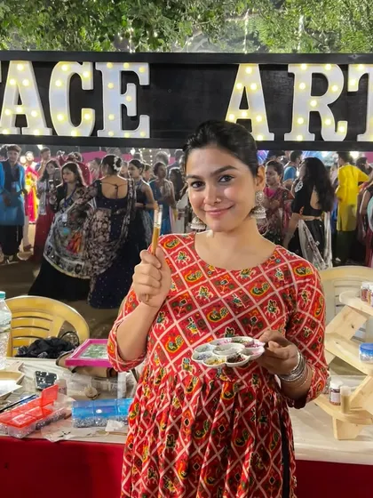 One of our artists at our stall during a Heritage Garba event, ready to create some festive looks.