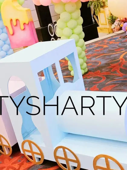 A pastel-colored train prop, perfect for a Candyland or transportation-themed party for young children.