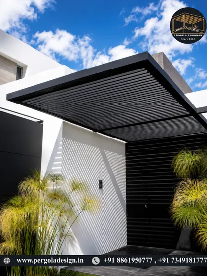 A minimalist cantilevered pergola providing shade over a modern entrance. The clean lines and louvered design create a sleek and sophisticated look that complements the home's architecture.