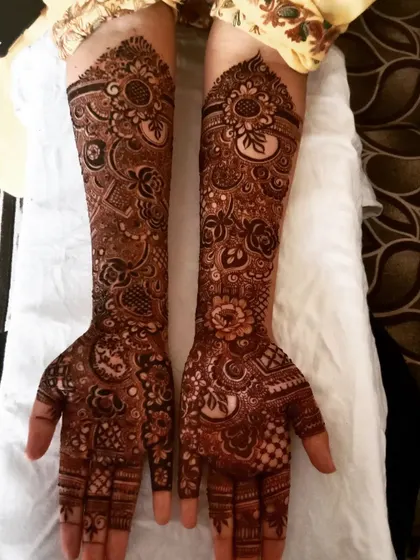 This full bridal design features a beautiful mix of floral and traditional patterns. The density and detail are perfect for a bride's special day.