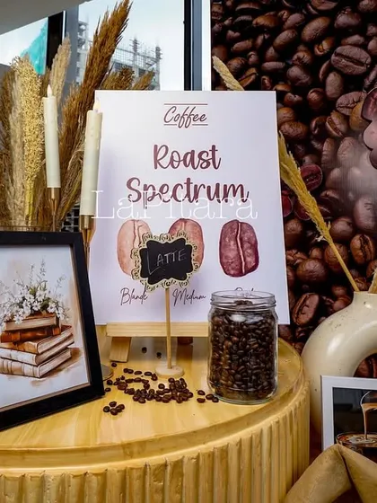 Another detailed decor setup showing a "Roast Spectrum" chart. These educational touches add depth to the theme, engaging guests beyond just food and drink.
