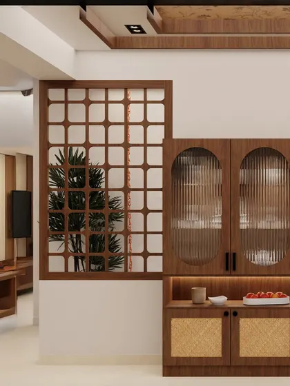 For this project, the client wanted an elegant, non-bulky crockery unit. We designed this piece with warm wood, fluted glass, and rattan accents, pairing it with a matching dining table to create a simple, functional, and cohesive space.