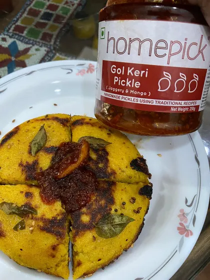 A perfect Sunday morning for a Gujarati household often includes handvo, chai, and a generous helping of Gol Keri pickle. It's a combination that brings comfort and flavour together.