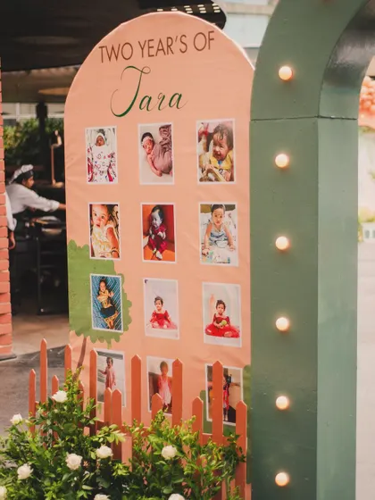 A 'Two Years of Tara' milestone board showcases precious monthly photos. It's a beautiful tribute to her journey and a wonderful conversation piece for guests.