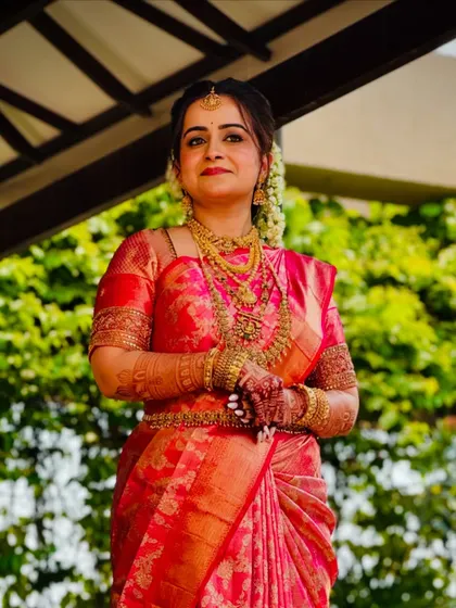 A close-up of the happy bride. The saree is draped to be comfortable and secure, so she can enjoy her day without any worries.