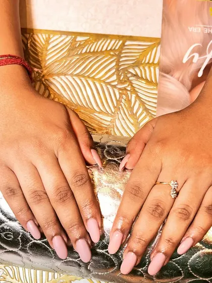 A simple and chic set of solid dusty rose gel nail extensions. This versatile color is perfect for an everyday look that is both professional and pretty.