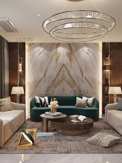 This living room showcases a beautiful book-matched marble feature wall, framed by dark wood paneling. The contrast of the dark green sofa and neutral chairs creates a balanced and luxurious seating area.