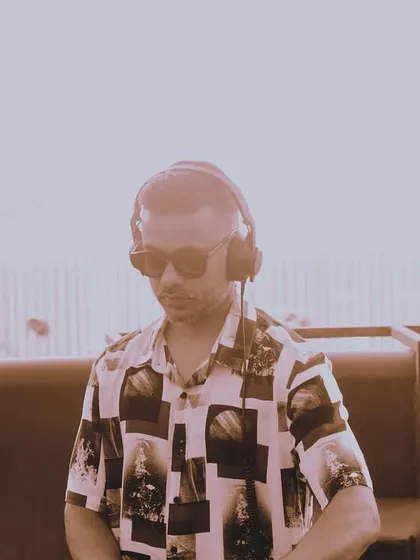 A candid shot from a daytime set. Even in a more relaxed environment, I'm completely focused on delivering the perfect soundtrack for the occasion.