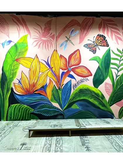 The full tropical leaf mural, featuring oversized flowers, butterflies, and dragonflies against a soft pink background. This piece makes a bold and beautiful statement.