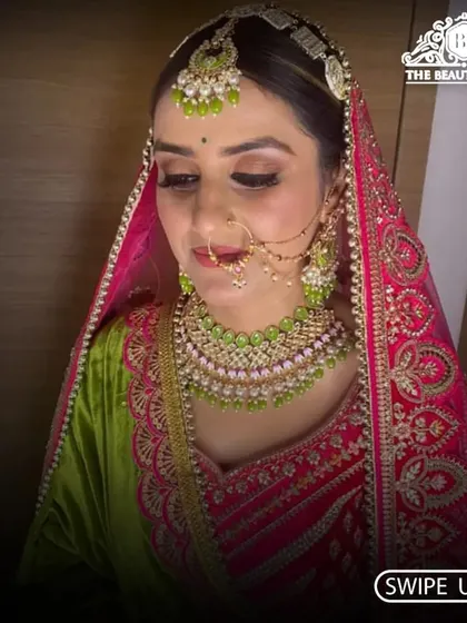 A detailed shot of the bride's makeup, showing the seamless blending and contouring that defines her features beautifully under the veil.