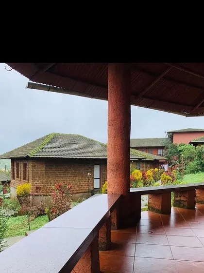 A view of the student cottages and gardens at the Amboli ashram. The accommodations are simple and comfortable, designed to support a focused and disciplined spiritual practice.