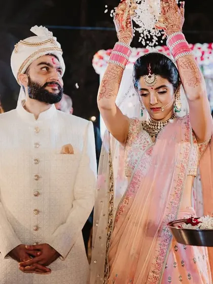 A ritual where the bride showers the groom with rice or flowers, a beautiful tradition symbolizing prosperity and happiness.