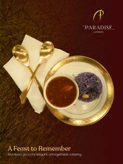A feast to remember. This plate of purple rice and savory curry, served with golden spoons, represents the elegant and unforgettable catering we are known for.