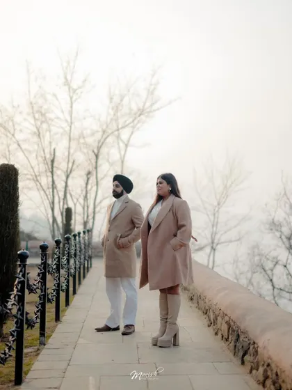 A classic portrait on a stone walkway in Kashmir, the misty background adding to the moody and romantic atmosphere.