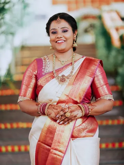 A full portrait of Meghana, looking elegant and put-together for her cousin's wedding.