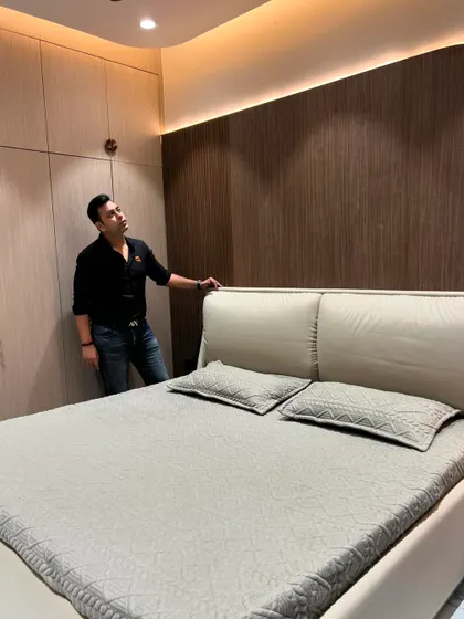 This angle shows the custom wardrobe that complements the bed's design.
