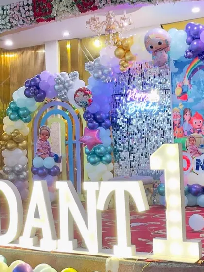 A closer look at the large, light-up 'VEDANT' and '1' signs. These marquee letters are a great way to personalize the decor and make a statement.