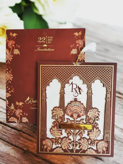 An example of my intricate laser-cutting work, this invitation is crafted from a sturdy MDF base. The detailed floral and architectural patterns create a stunning 3D effect, making it not just an invite, but a keepsake.