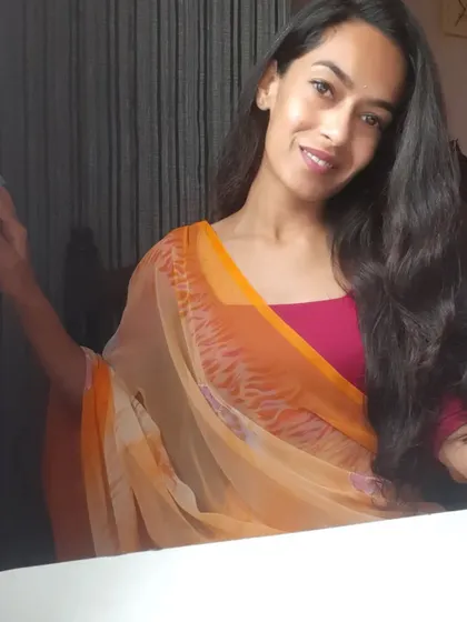 A simple, warm look in a traditional dupatta, perfect for a daytime family gathering or puja.