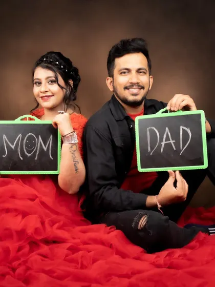 A fun and cute shot of the parents-to-be. Her makeup is simple and pretty, perfect for this playful photo.