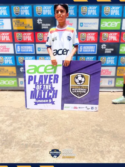 A player receives the Player of the Match award for his performance in the U9 DPDL.