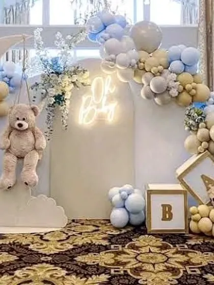 A closer look at the teddy bear on the moon prop, a popular element for celestial-themed baby showers and birthdays.
