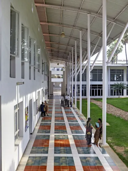 The shaded walkways at Sona College are designed to encourage lingering and interaction. These spaces are central to our design philosophy of creating a "friendly campus" where friendships are built and social energy thrives.