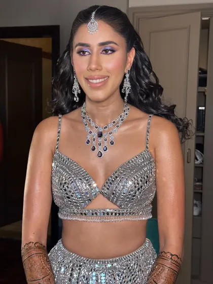 A close-up of the purple sangeet look. The pop of color on the eyes is fun and festive, perfect for a night of dancing.